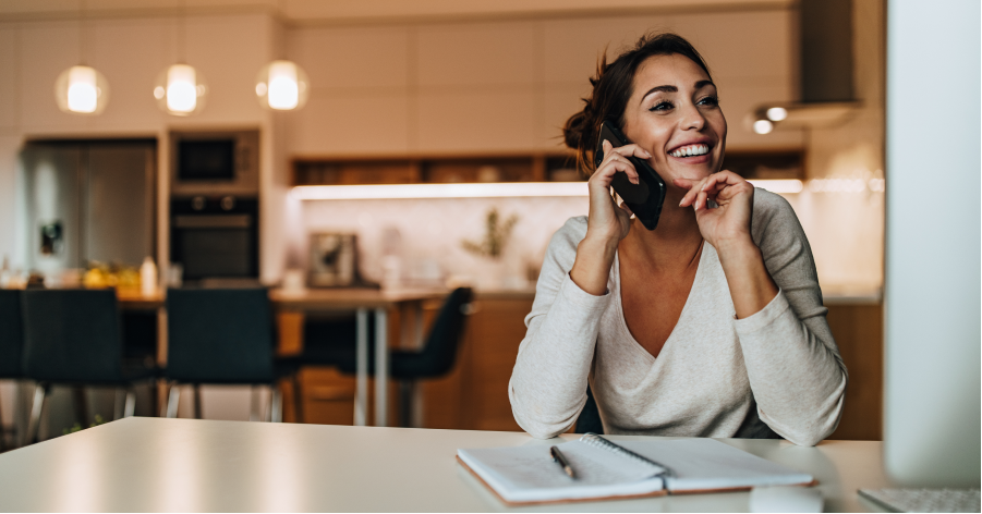 Woman learns how to fix her credit score while talking on the phone with a KOFE coach.