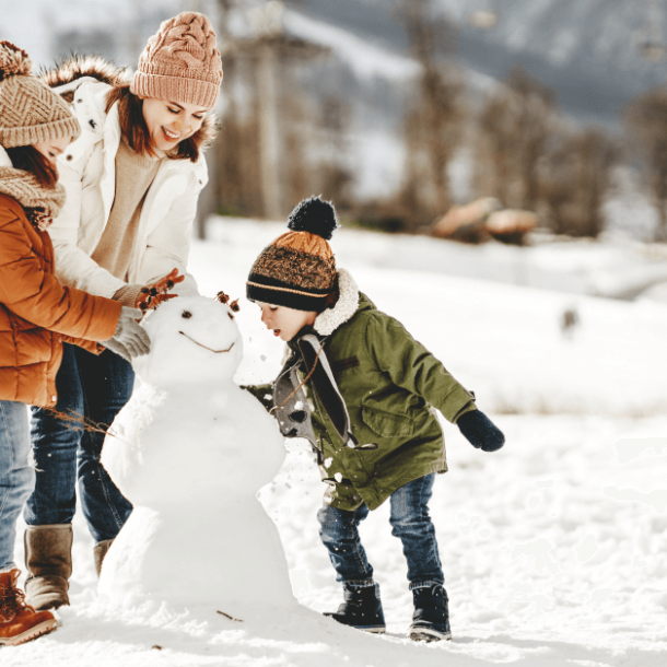 happy family mother and children having fun on winter walk