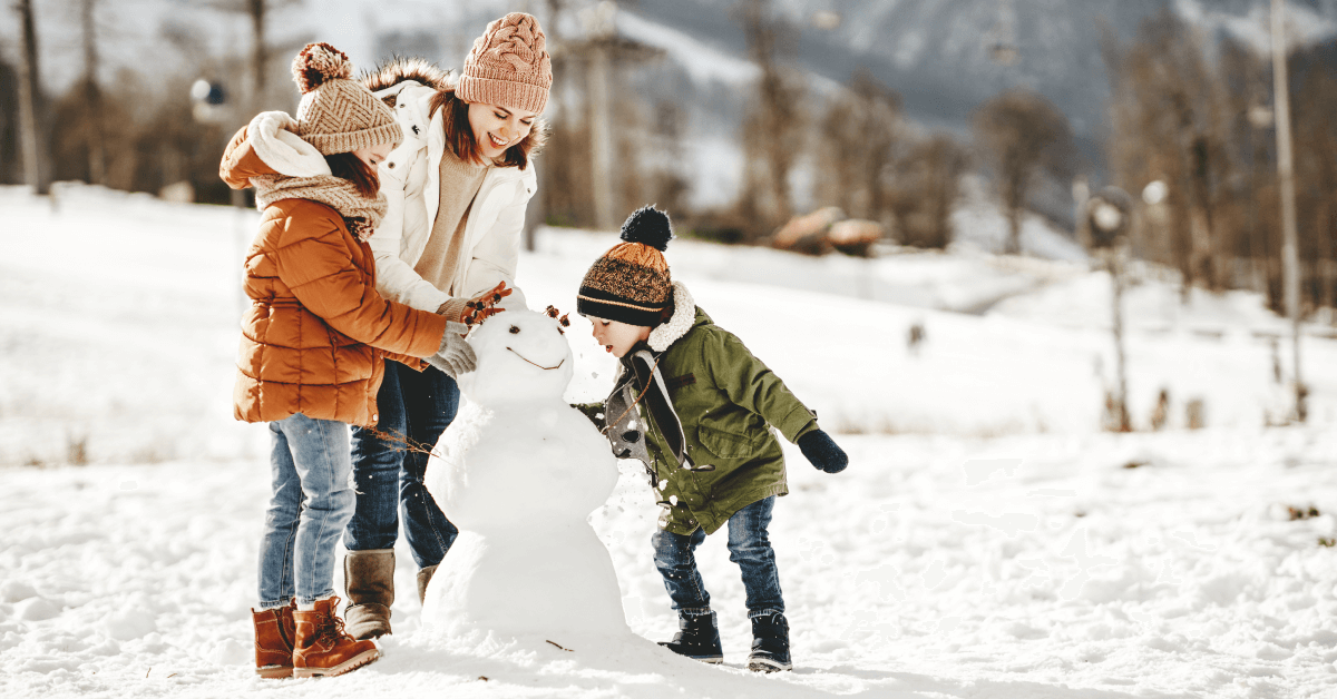 happy family mother and children having fun on winter walk