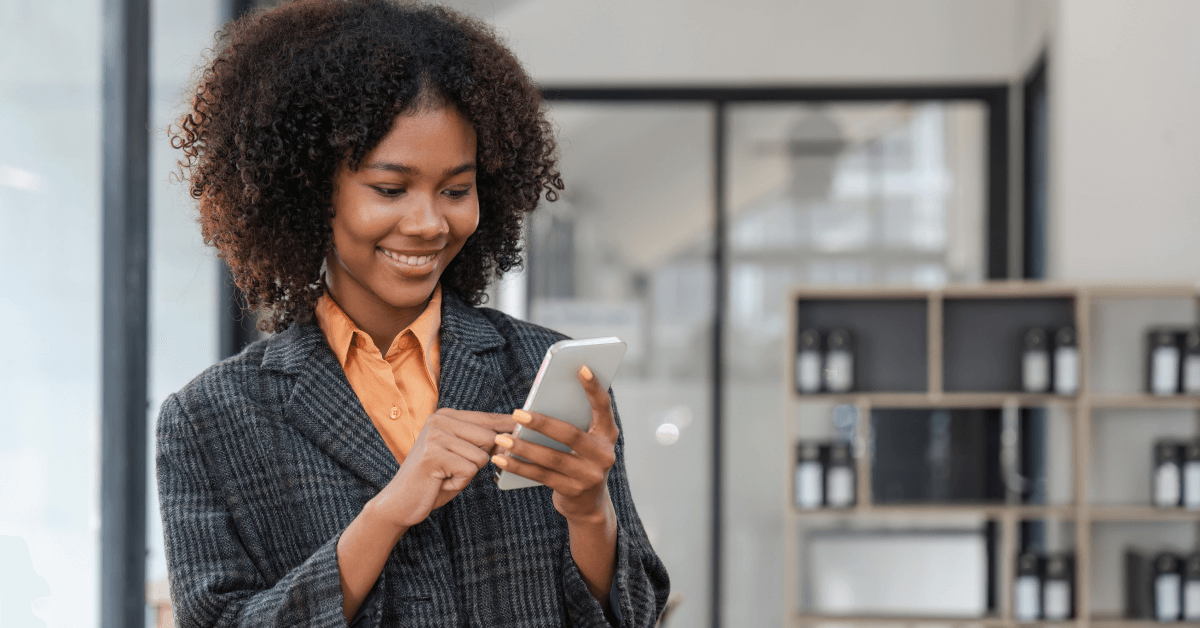 business woman in the office, happy and smiling