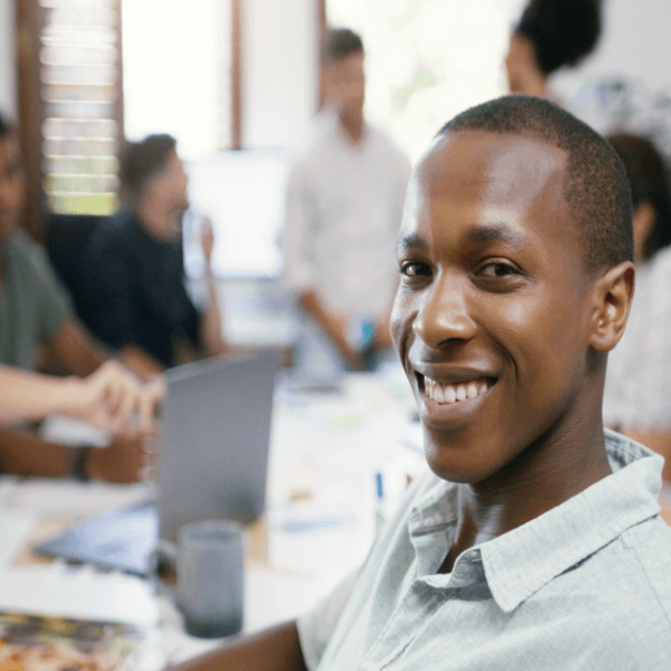 Teamwork, portrait of businessman and people in a business meeting. Collaboration or diversity, communication or planning and coworkers talking or brainstorming at a table at their workplace